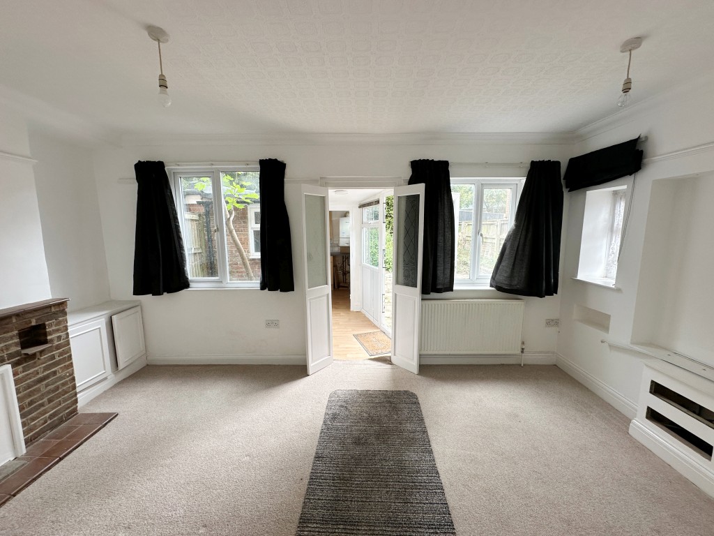 Lot: 147 - TWO-BEDROOM SEMI-DETACHED HOUSE FOR IMPROVEMENT - Dining Room with Doors into Kitchen